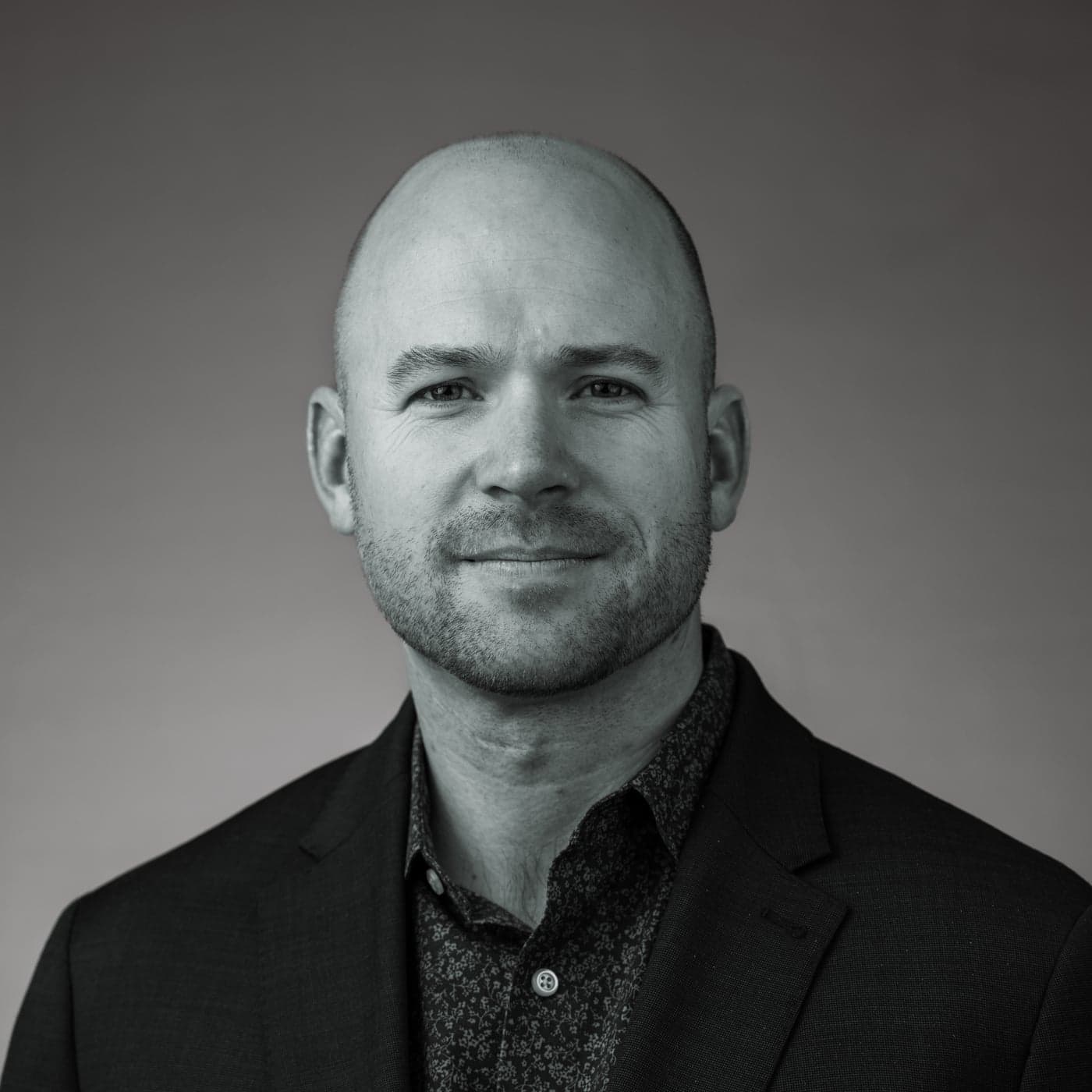 Black and white portrait of Brendan MacDougall.